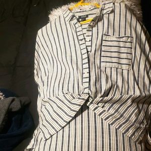 Button up blouse rolled sleeves.